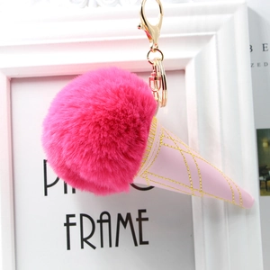 Detail of rose red faux fur pompom ice cream keychain with pink quilted leather cone