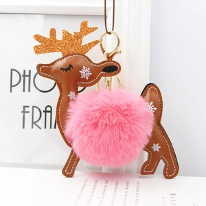Detail of reindeer faux fur keychain with leather craft and sparkling gold antlers