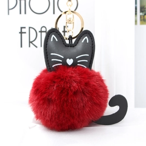 Cute red faux fur pompom cat keychain with black leather accents and gold hardware
