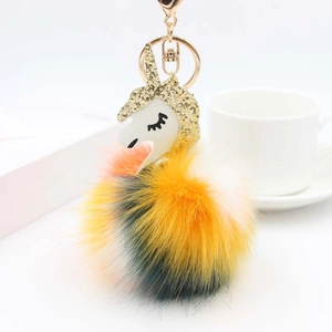 Rainbow fluffy unicorn keychain with golden glitter horn and soft colorful faux fur ball