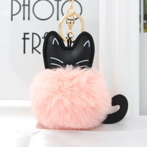 Detailed close-up of a pink plush cat pompom keychain with gold alloy lobster clasp