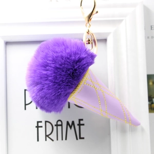 Close-up of purple faux fur ice cream pom pom keychain with lavender leather cone detail