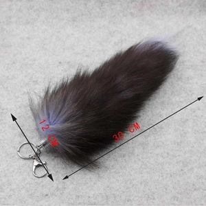 Detail view of large 30cm faux fox fur tail keychain with metal lobster clasp and ring