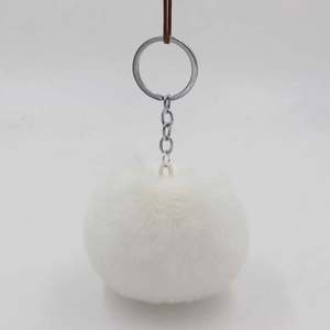 Detail of 8cm white faux rabbit fur pom pom keychain with silver metal ring and chain