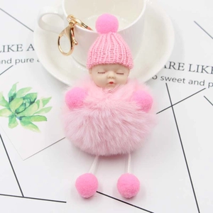 Pink plush sleeping baby keychain with knit hat and golden metal ring accessory
