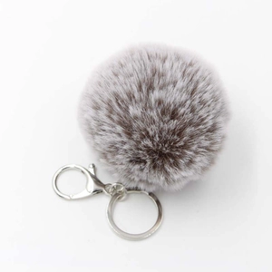 Plush faux fur pompom keychain in taupe and white with silver metal lobster clasp
