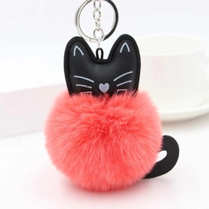 Pink plush pom pom cat keychain with black leather ears and silver metal hardware