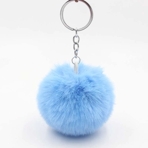 Light blue fluffy faux fur pompom keychain with silver metal ring for bags and car keys