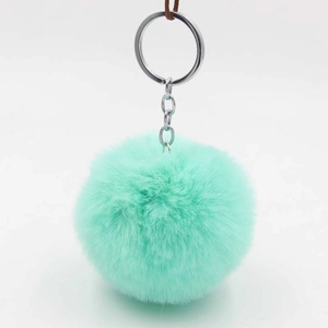 Detail of mint green plush ball keychain with high-quality silver metal ring connector