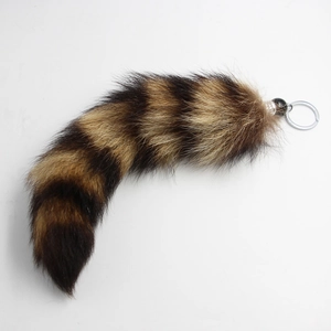 Macro detail of the fluffy striped fur texture and silver metal keychain ring