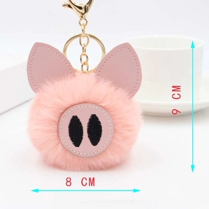 Détail du porte-clés cochon en peluche rose avec dimensions de 8 cm et 9 cm