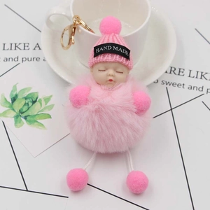 Cute pink sleeping baby plush keychain with faux fur ball and gold metal ring for bags