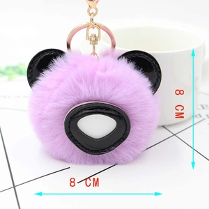 Détail de l'ours en peluche violet 8cm avec fourrure douce et fermoir mousqueton doré