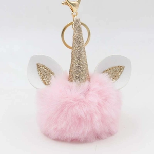Detail of pink plush unicorn keychain with gold sequin horn and metallic lobster clasp
