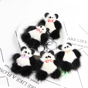 Lot de 5 porte-clés panda en peluche avec nœuds papillon sur une assiette décorative