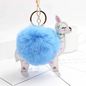 Blue pompom alpaca keychain with floral pattern and golden metal keyring clasp