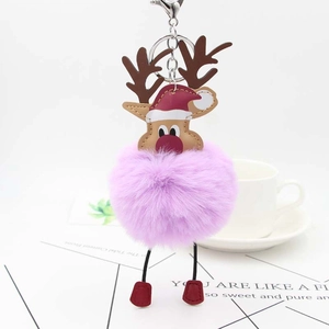 Christmas reindeer bag charm with purple faux fur pompom and leather reindeer head detail