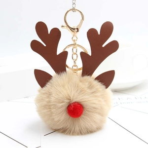 Porte-clés renne de Noël avec pompon en peluche beige et mousqueton en métal doré élégant