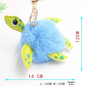 Detail showing dimensions of blue faux fur turtle plush keychain with golden metal clasp