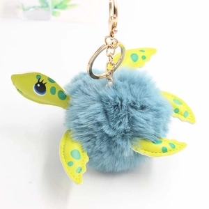 Blue plush turtle keychain with green leather limbs and golden metal lobster clasp