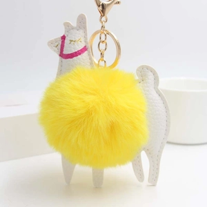 Alpaca keychain with white faux leather and a large bright yellow fluffy fur pompom