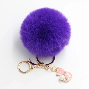 Fluffy purple plush pom pom keychain with gold lobster clasp and pink enamel cat pendant
