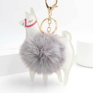 White alpaca faux leather keychain with gray fluffy fur ball and gold lobster clasp