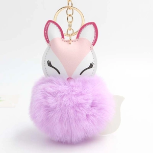 Cute sleeping fox plush keychain with purple faux fur pompom and golden keyring loop