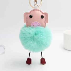 Porte-clés cochon mignon en similicuir rose et pompon vert menthe avec fermoir doré