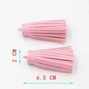 Pair of 6.5cm pink PU leather tassels for keychains or bag accessories on white background