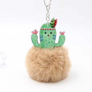 Cute cactus pom-pom keychain with green acrylic charm and soft tan faux fur ball