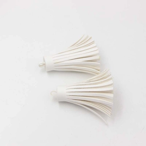 Detail of white PU leather tassels with top hanging rings for bags and DIY crafts