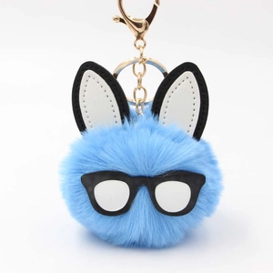 Sky blue plush rabbit fur keychain with leather ears and black frame glasses charm