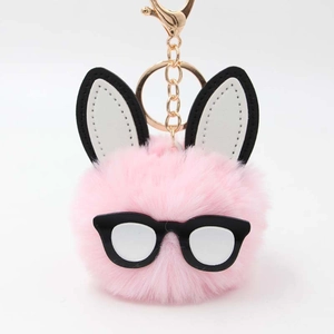 Cute pink plush bunny ball keychain with black glasses and gold ring for handbag decor