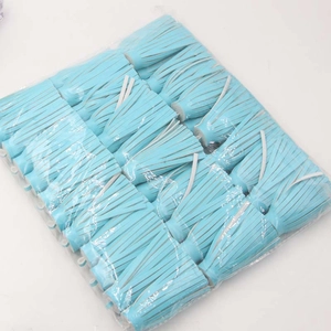 Bulk wholesale pack of light blue PU leather tassels with white cords for DIY crafts