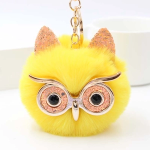Porte-clés chouette en peluche jaune avec yeux pailletés et anneau en métal doré