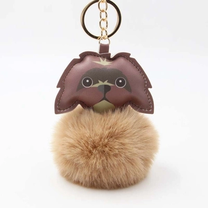 Cute puppy fur ball keychain with brown leather patchwork and golden metal clip