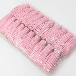 Bulk pack of pink PU leather tassels with metal jump rings for DIY bag and keychain decor