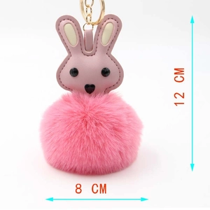 Detailed view of pink plush bunny keychain showing 12cm height and soft faux fur texture