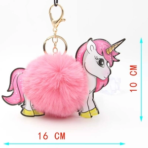 Detail view of plush unicorn pompom keychain with dimensions 16cm by 10cm