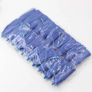 Detail view of deep blue PU tassel pendants for DIY bags and accessories in bulk packaging