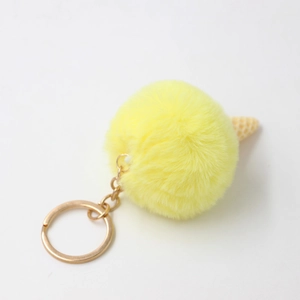 Bright yellow plush pom pom ice cream keychain with waffle cone detail and gold metal ring