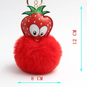 Plush strawberry keychain with red faux fur pompom and 12cm height size dimensions
