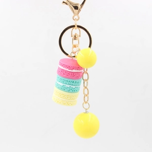 Colorful resin macaron keychain pendant with yellow beads and golden metal lobster clasp