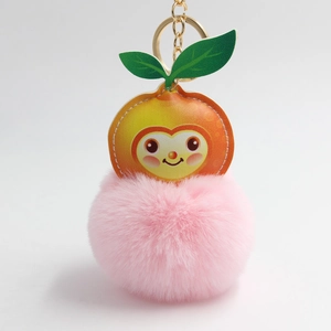 Fluffy pink plush ball keychain with a cute cartoon peach leather charm and gold ring