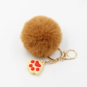 Porte-clés pompon en fausse fourrure marron avec charmant pendentif patte de chien