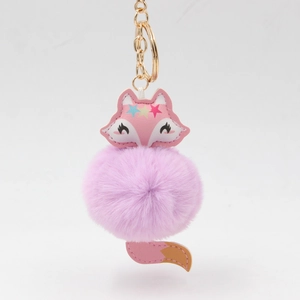 Porte-clés renard rose mignon avec pompon en fourrure violette et métal doré