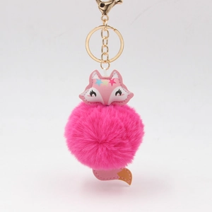 Porte-clés renard en fourrure rose moelleuse avec étoiles et fermoir doré
