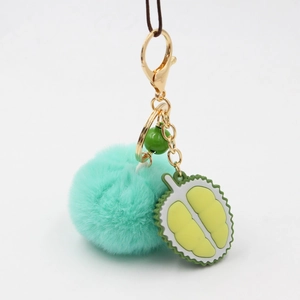 Durian fruit plush pompom keychain with green bell and lobster clasp on grey background