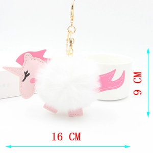 Pink unicorn plush keychain with white faux fur pompom and size dimensions of 16cm by 9cm